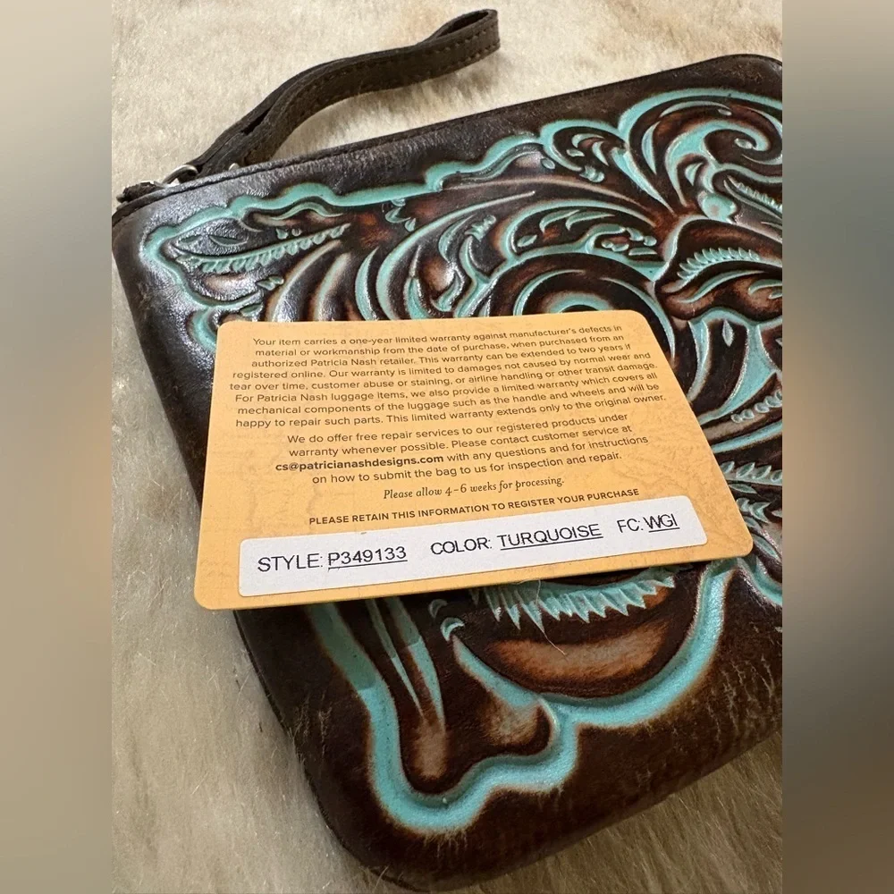 Patricia Nash Cassini Wristlet
Tooled Turquoise - Picture 2 of 8